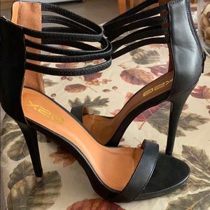 Never Used Very elegant black strappy heels.